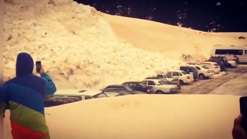 Watch an avalanche bury more than a dozen cars