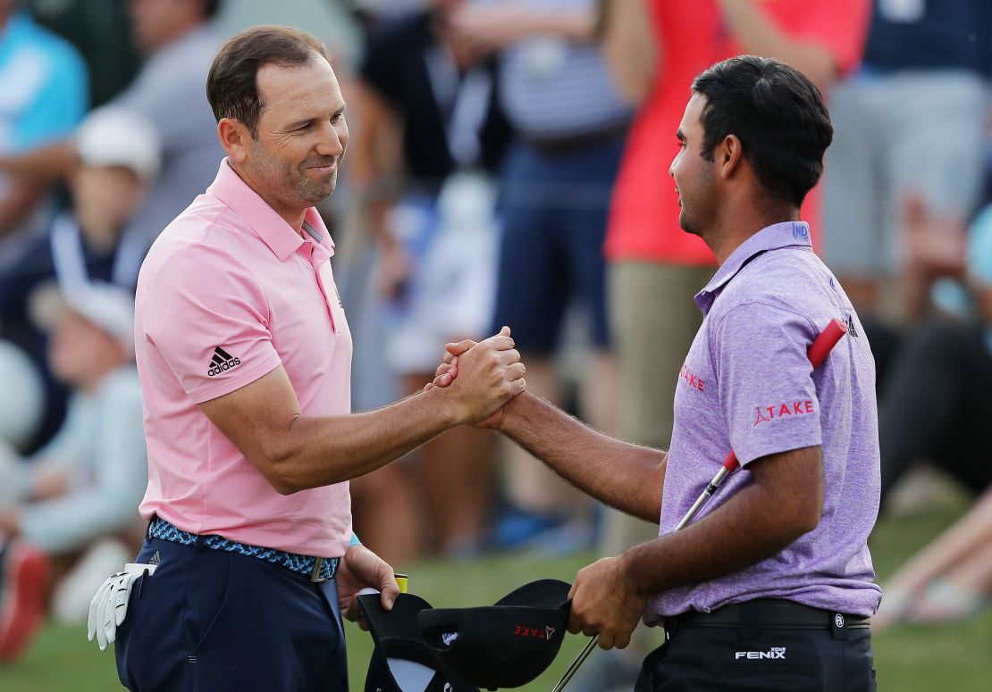 Sharma shakes hands with reigning Masters champion Sergio Garcia after losing to the Spaniard in March's WGC Match Play.