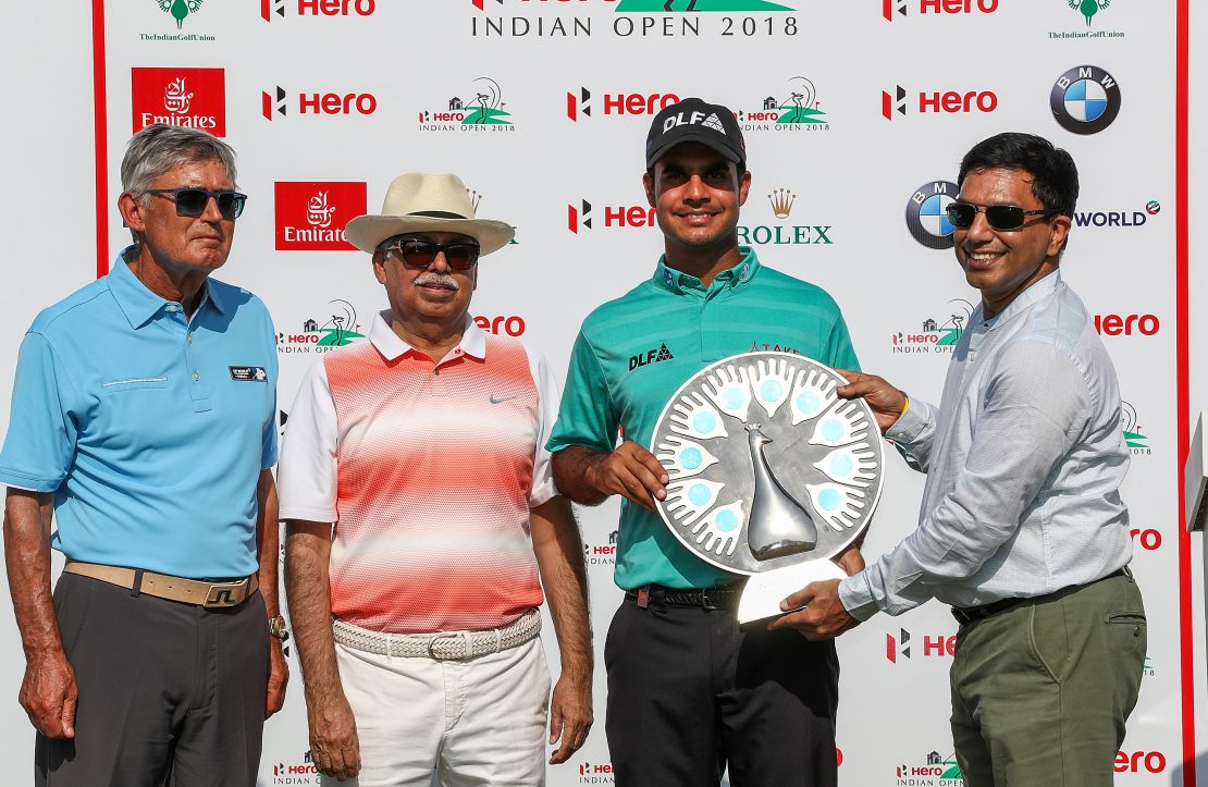 Sharma is presented with an award for the most promising Indian golfer by Director of The European Tour David Williams (L).