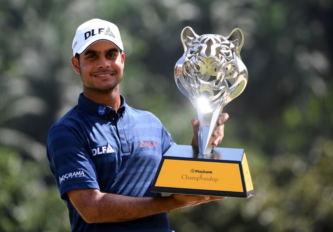 Sharma poses with the Maybank Championship trophy in February 2018.