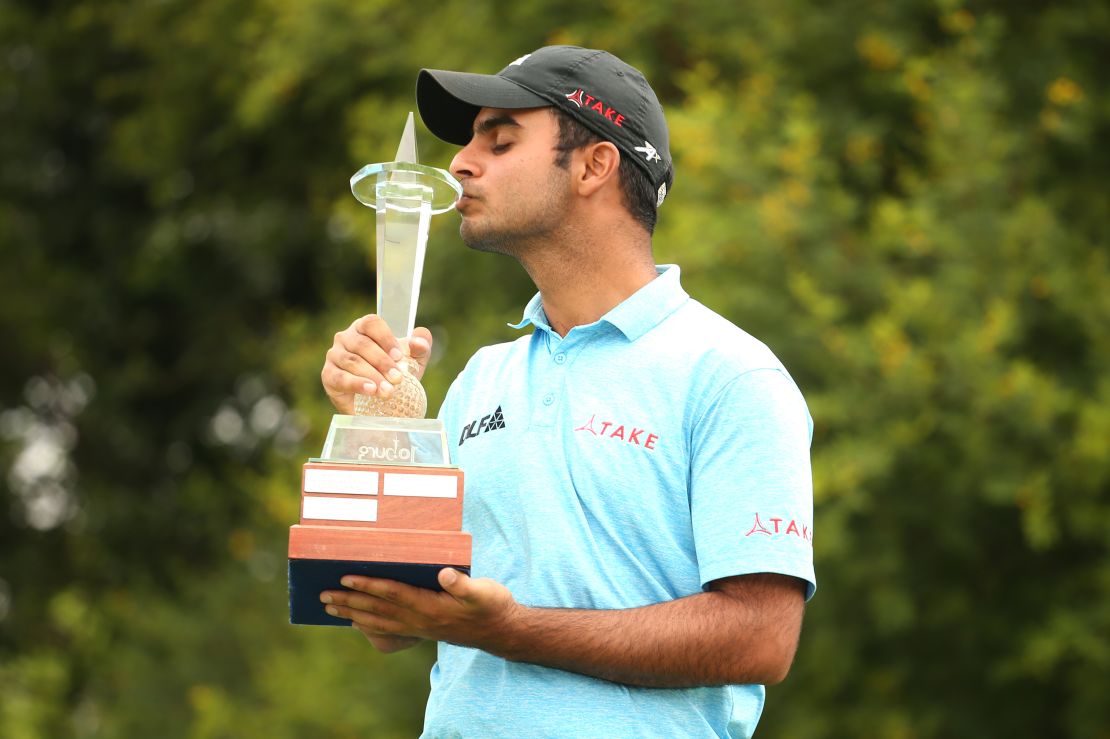 Sharma poses with the Joburg Open trophy at Randpark Golf Club in December 2017.