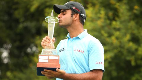 Sharma poses with the Joburg Open trophy at Randpark Golf Club in December 2017.