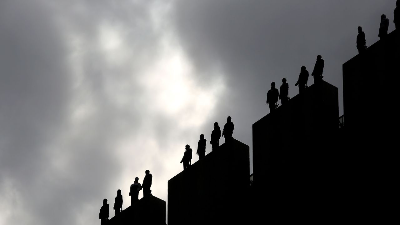 The sculptures were made from packing tape and will remain on rooftops until April 1.