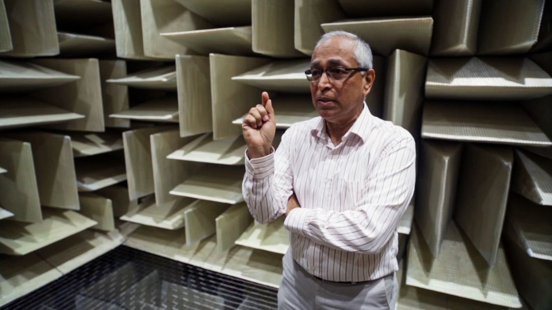 Hundraj Gopal, a speech and hearing scientist and the principal designer of the anechoic chamber at Microsoft, stands inside the room. Construction took one and a half years.