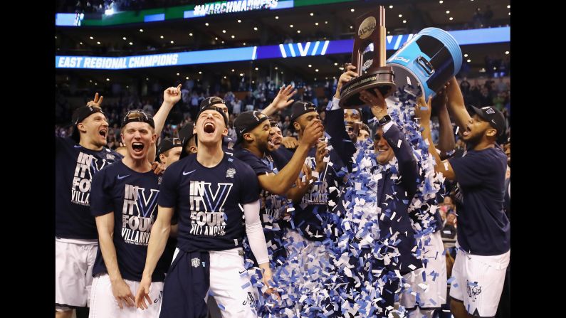 Villanova players dump confetti on head coach Jay Wright after the Wildcats defeated Texas Tech 71-59 on Sunday, March 25. Villanova will face Kansas in the Final Four this weekend.