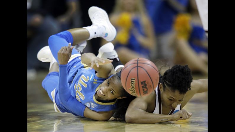 UCLA's Jordin Canada, left, and Mississippi State's Morgan William dive for a loose ball during an NCAA Tournament game on Sunday, March 25. Mississippi State won 89-73 to advance to the Final Four.