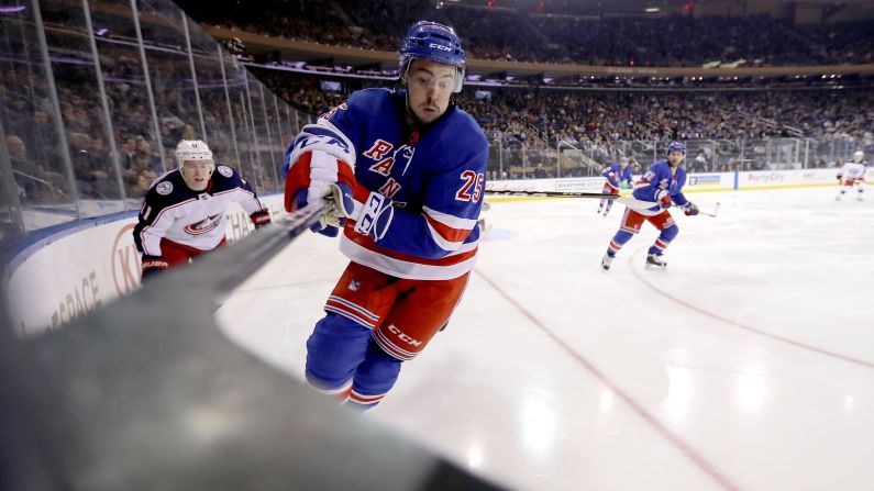 Ryan Sproul, a defenseman for the New York Rangers, reaches for the puck during an NHL game against Columbus on Tuesday, March 20.