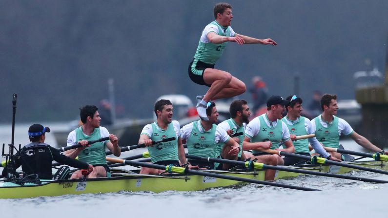 Rob Hurn jumps into London's River Thames to celebrate Cambridge's victory over Oxford in the schools' annual rowing race on Saturday, March 24.