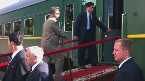 North Korean leader Kim Jong-Il enters his armoured carriage at a station in Novobureisky, Russian on August 21, 2011.
