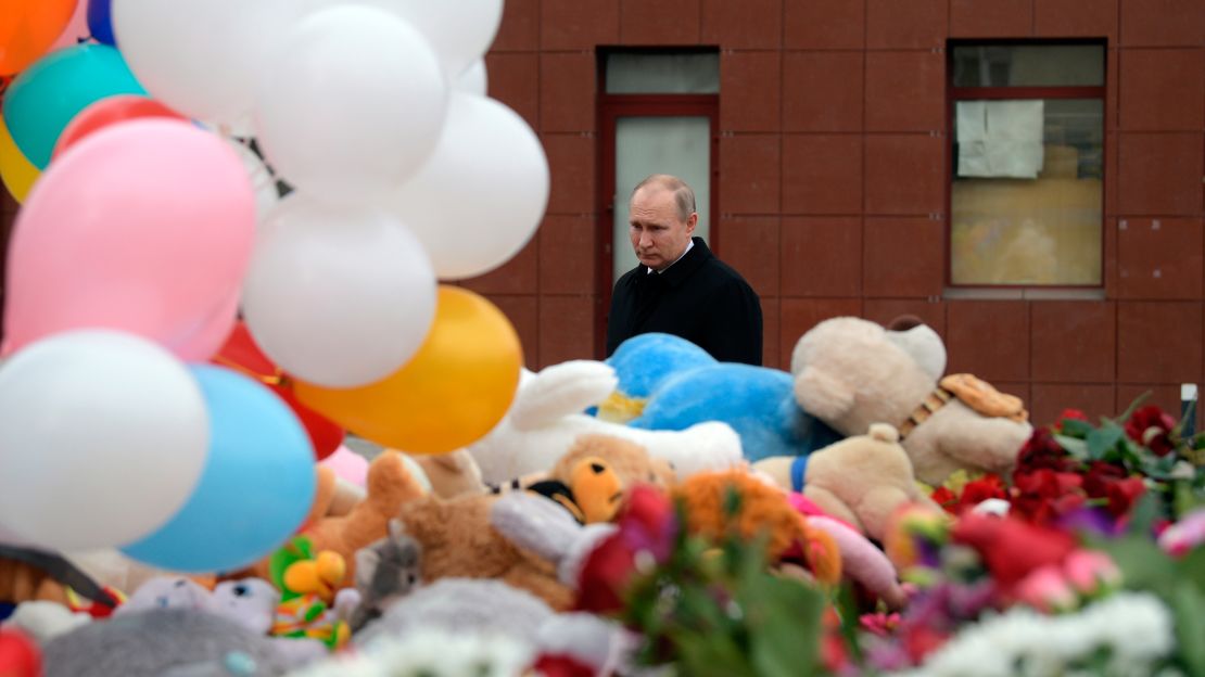 Russian President Vladimir Putin visits a memorial for the victims of the fire on Tuesday.