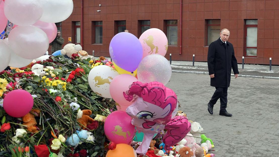 Russian President Vladimir Putin visits a memorial for the victims of the fire on Tuesday