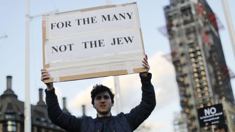Members of the Jewish community protest against Corbyn and anti-Semitism outside Parliament in March.