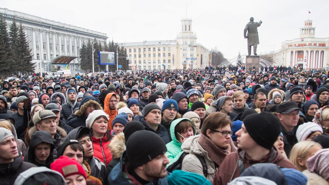 Locals angered and distraught over the fire gather in central Kemerovo.