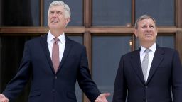 WASHINGTON, DC - JUNE 15:  Supreme Court Justice Neil Gorsuch (L) talks with Chief Justice John Roberts (R) on the steps of the Supreme Court following his official investiture at the Supreme Court June 15, 2017 in Washington, DC. Gorsuch has been an active member of the court since his confirmation though the official investiture ceremony was held today.  (Photo by Win McNamee/Getty Images)