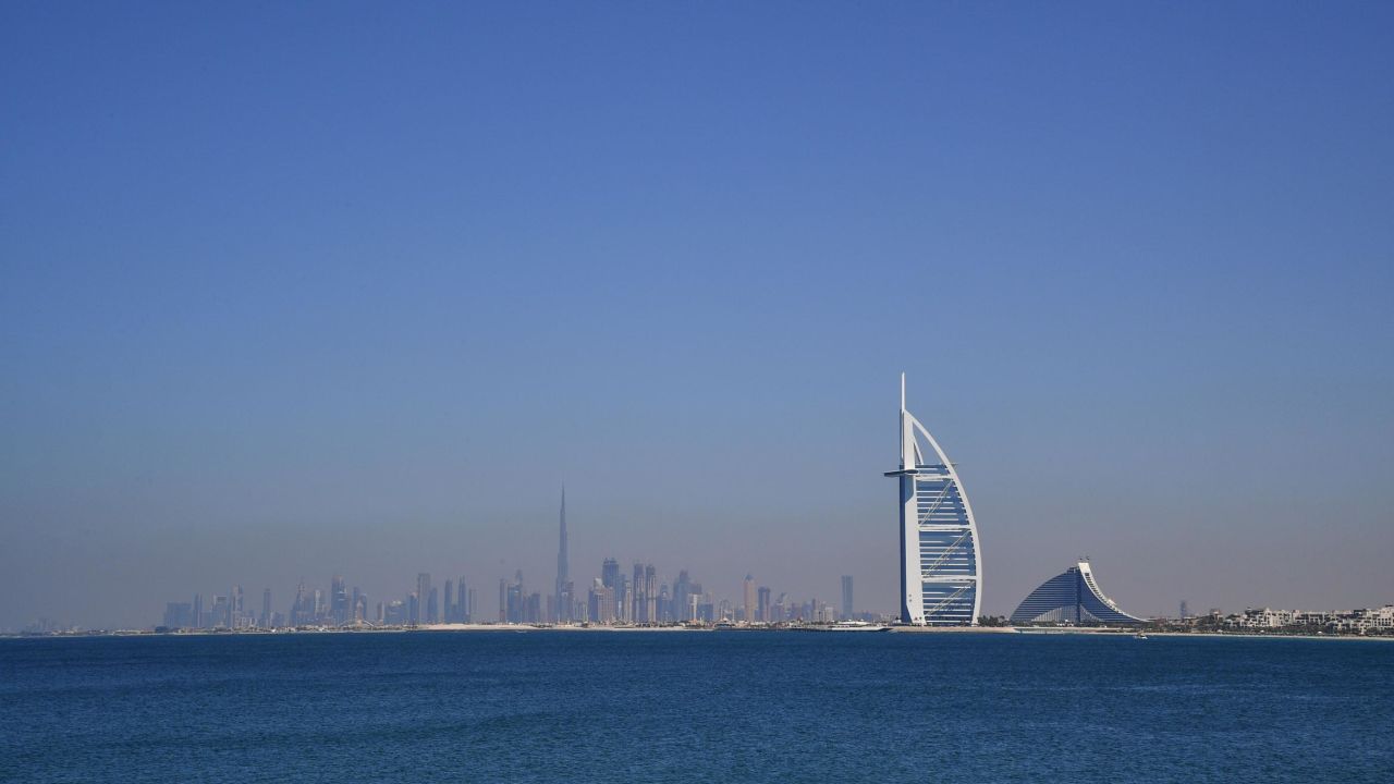 A picture taken on March 14, 2018 shows the skyline of Dubai with the Burj al-Arab in the foreground and the Burj Khalifa (L) in the background. / AFP PHOTO / GIUSEPPE CACACE (Photo credit should read GIUSEPPE CACACE/AFP/Getty Images)