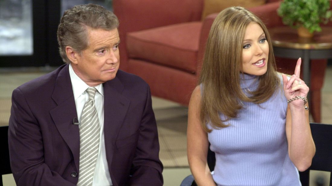 Talk show host Regis Philbin and new co-host Kelly Ripa speak to the audience during a broadcast of "Live with Regis and Kelly" in New York City on February 5, 2001.