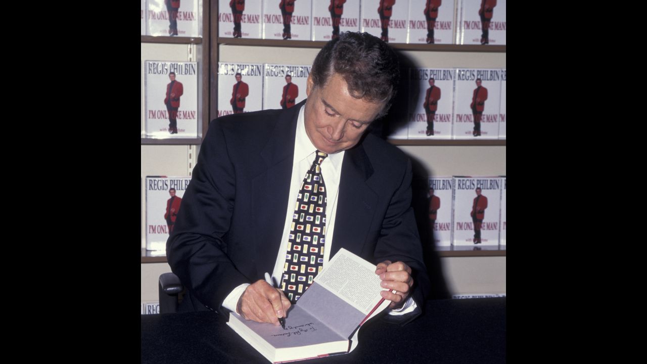 Regis Philbin signs a copy of his book titled "I'm Only One Man!" at a B. Dalton Bookstore in New York City on September 12, 1995.