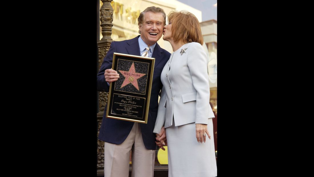 Regis Philbin and his wife Joy pose for a photograph after he received a star on the Hollywood Walk of Fame on April 10, 2003, in Hollywood, California. 
