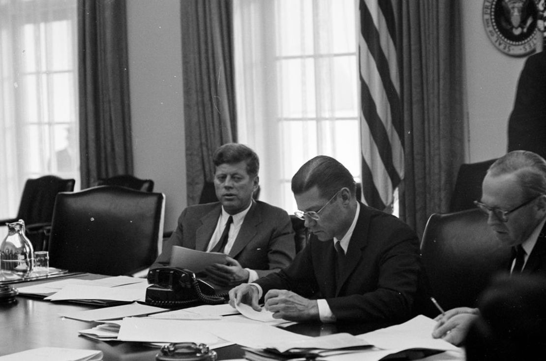President Kennedy and Defense Secretary Robert McNamara confer on the crisis in October 1962.   