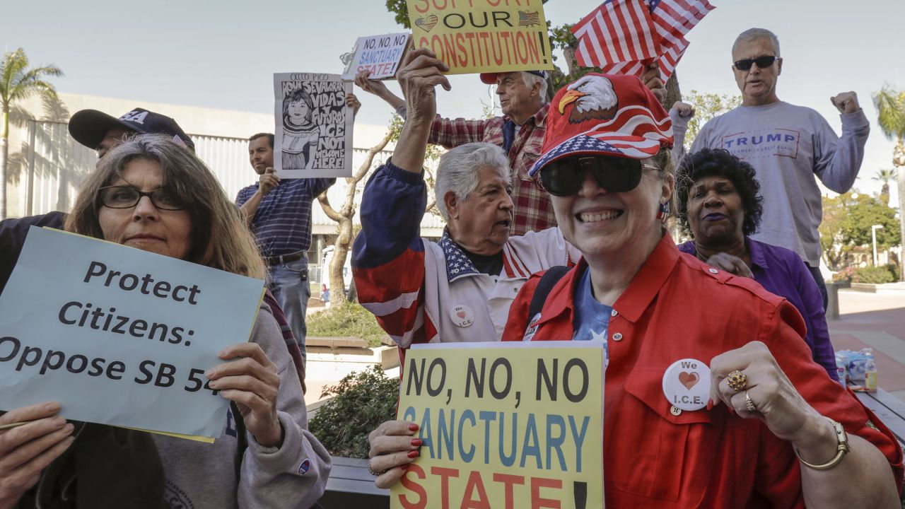People opposing SB 54 celebrate Tuesday in Santa Ana, California.