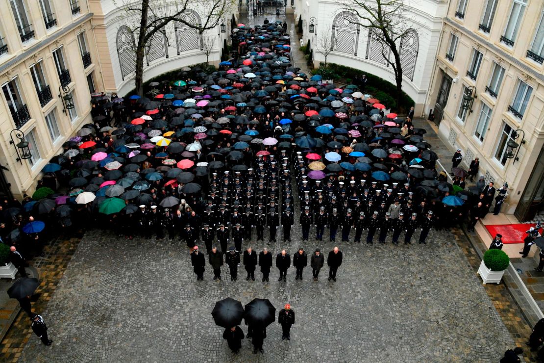 A minute of silence is held for  Beltrame at the Interior Ministry in Paris.
