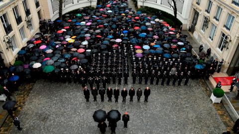 A minute of silence is held for  Beltrame at the Interior Ministry in Paris.
