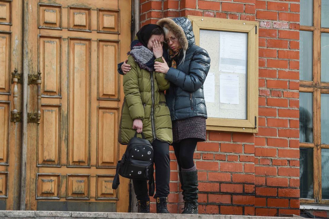 Women grieve at a funeral service in Kemerovo on Wednesday.