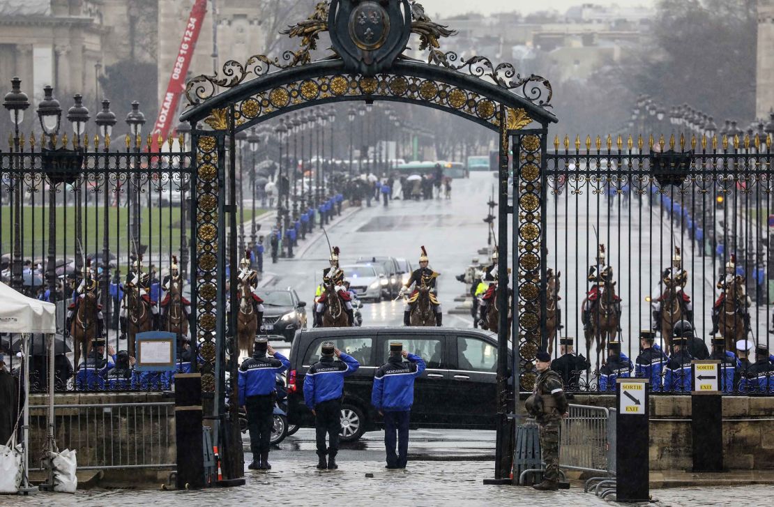 A convoy of French Republican Guards escort the hearse carrying Beltrame's coffin.