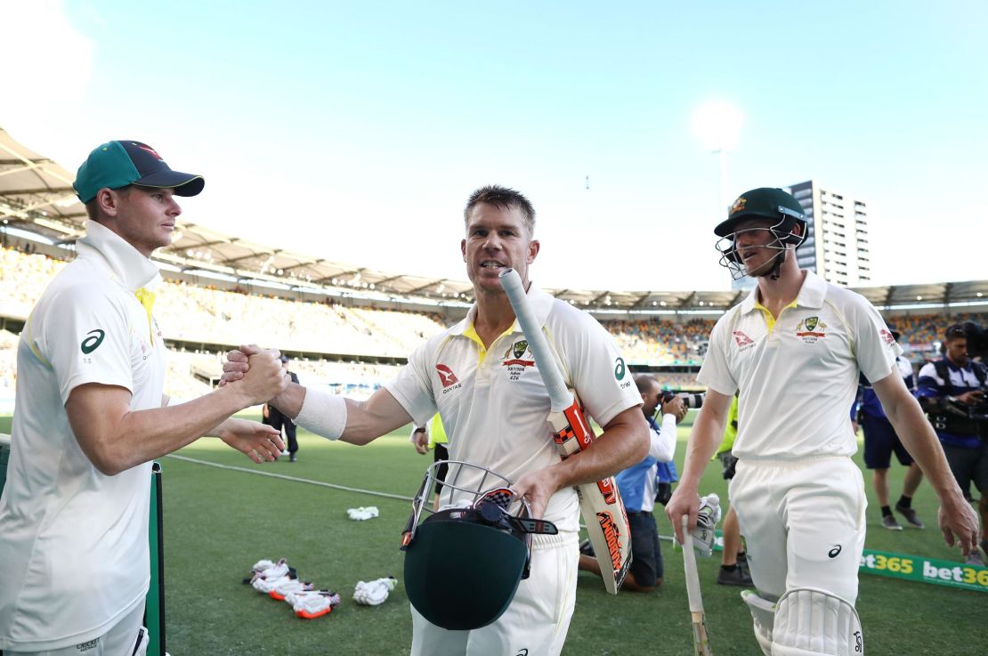 Smith congratulates  Warner and Bancroft on day four of the First Test Match of the 2017/18 Ashes Series between Australia and England at The Gabba on November 26, 2017 in Brisbane, Australia. 