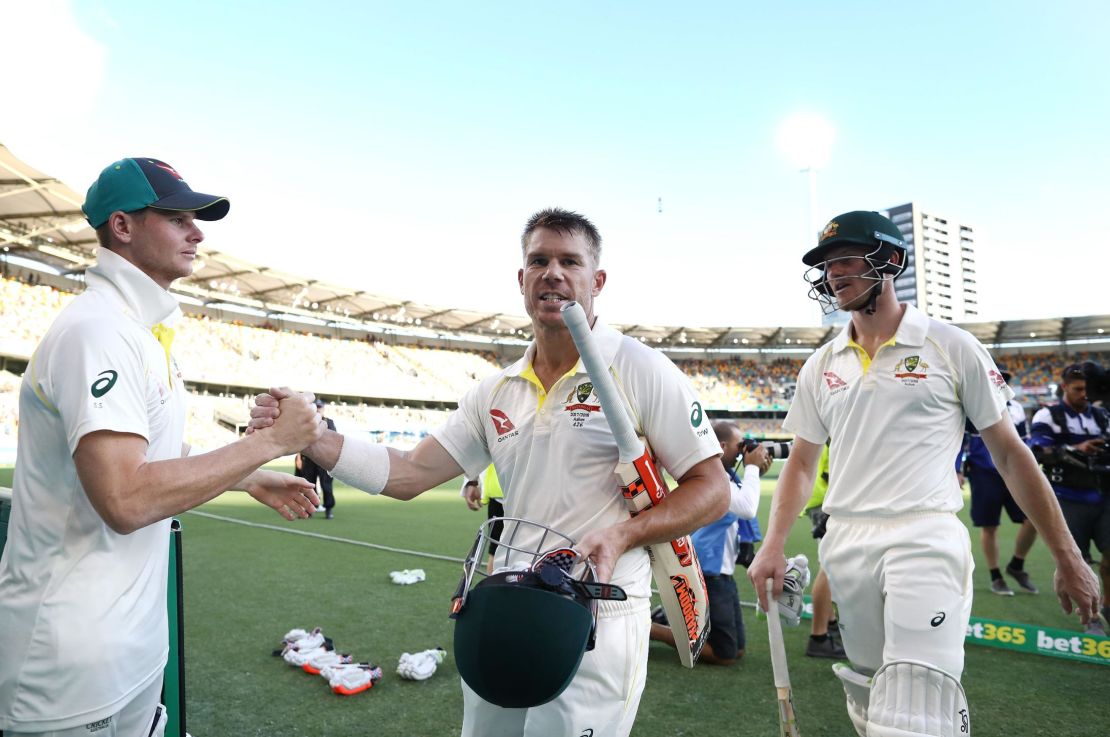 Smith congratulates Warner and Bancroft on day four of the First Test Match of the 2017/18 Ashes Series between Australia and England at The Gabba on November 26, 2017 in Brisbane, Australia.