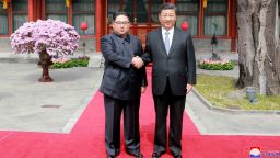 In this March 27, 2018, photo, North Korean leader Kim Jong Un, left, shakes hands with Chinese counterpart Xi Jinping at Diaoyutai State Guesthouse in Beijing, China. North Korea's leader Kim Jong Un and his Chinese counterpart Xi Jinping sought to portray strong ties between the long-time allies despite a recent chill as both countries on Wednesday, March 28, 2018, confirmed Kim's secret trip to Beijing this week. The content of this image is as provided and cannot be independently verified. Korean language watermark on image as provided by source reads: "KCNA" which is the abbreviation for Korean Central News Agency.  (Korean Central News Agency/Korea News Service via AP, File)