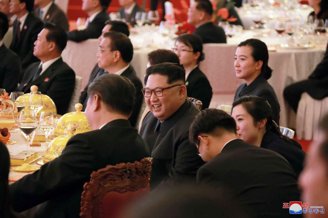 North Korean leader Kim Jong Un smiles as he and Chinese counterpart Xi Jinping attend a banquet at the Great Hall of the People in Beijing.