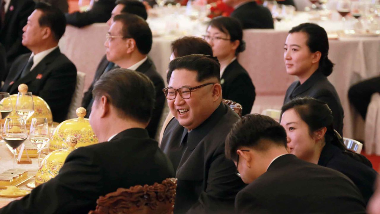 North Korean leader Kim Jong Un smiles as he and Chinese counterpart Xi Jinping attend a banquet at the Great Hall of the People in Beijing.