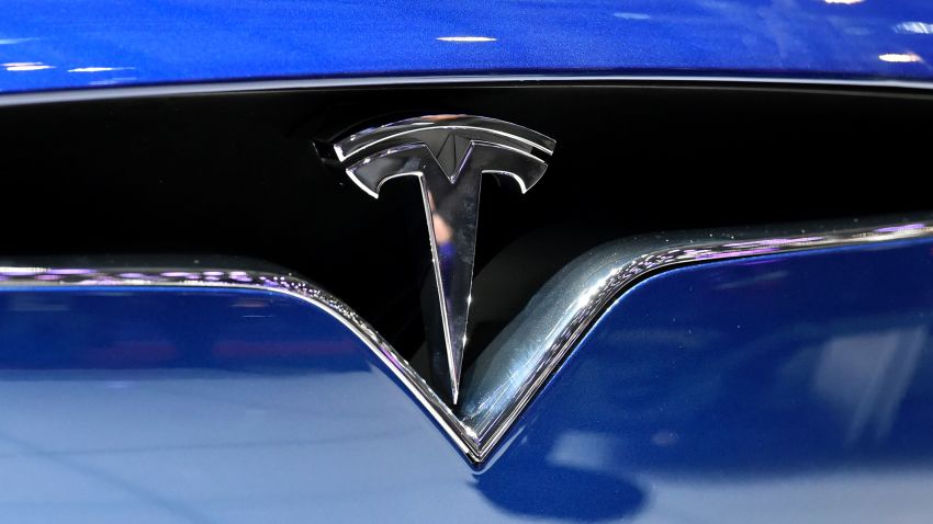 The logo of Tesla Motors is seen at the stand of US carmaker during the press day of the Geneva Motor Show on March 2, 2016 in Geneva. / AFP / FABRICE COFFRINI        (Photo credit should read FABRICE COFFRINI/AFP/Getty Images)
