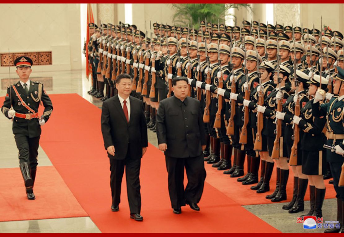 Chinese President Xi Jinping (left) and North Korean leader Kim Jong Un (right) are seen together in Beijing in a photograph released by North Korea's state-run Korean Central News Agency.