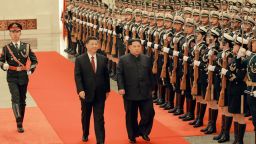 Chinese President Xi Jinping (left) and North Korean leader Kim Jong Un (right) are seen together in Beijing in a photograph released by North Korea's state-run Korean Central News Agency