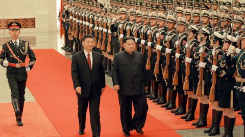 Chinese President Xi Jinping (left) and North Korean leader Kim Jong Un (right) are seen together in Beijing in a photograph released by North Korea's state-run Korean Central News Agency.