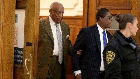 Andrew Wyatt, right, leaves court with Bill Cosby.