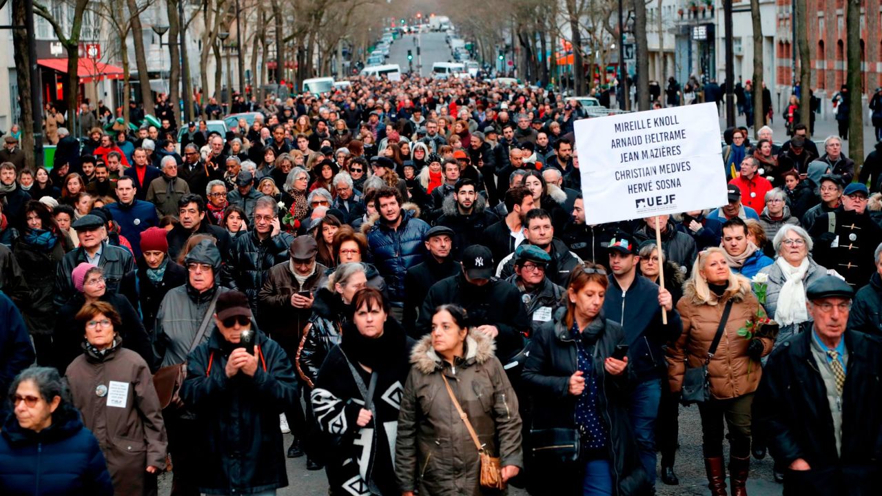 Participants walk holding placards during a silent march in Paris on March 28, 2018, in memory of Mireille Knoll, an 85-year-old Jewish woman murdered in her home in what police believe was an anti-Semitic attack.
The partly burned body of Mireille Knoll, who escaped the mass deportation of Jews from Paris during World War II, was found in her small apartment in the east of the city on March 23, by firefighters called to extinguish a blaze. / AFP PHOTO / FRANCOIS GUILLOT        (Photo credit should read FRANCOIS GUILLOT/AFP/Getty Images)
