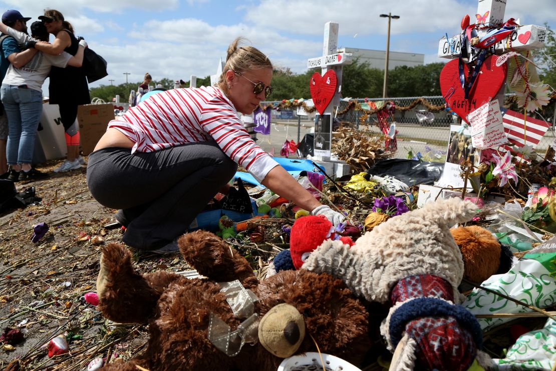 Volunteers sorted through teddy bears, flowers and hand-written letters honoring the 17 victims. 