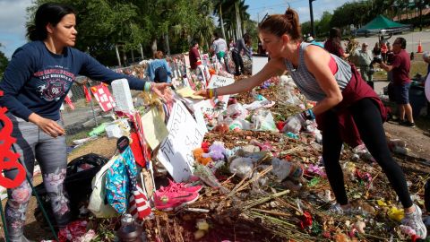 Patricia Padauy sift through tributes left for her son Joaquin Oliver.
