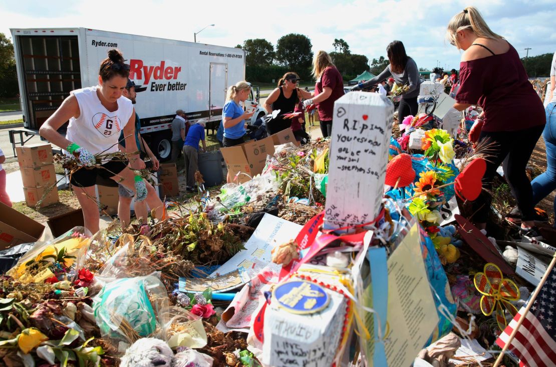 Photos, signed posters and other items were placed on cardboard boxes and loaded in a moving truck.