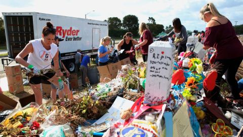 Photos, signed posters and other items were placed on cardboard boxes and loaded in a moving truck.