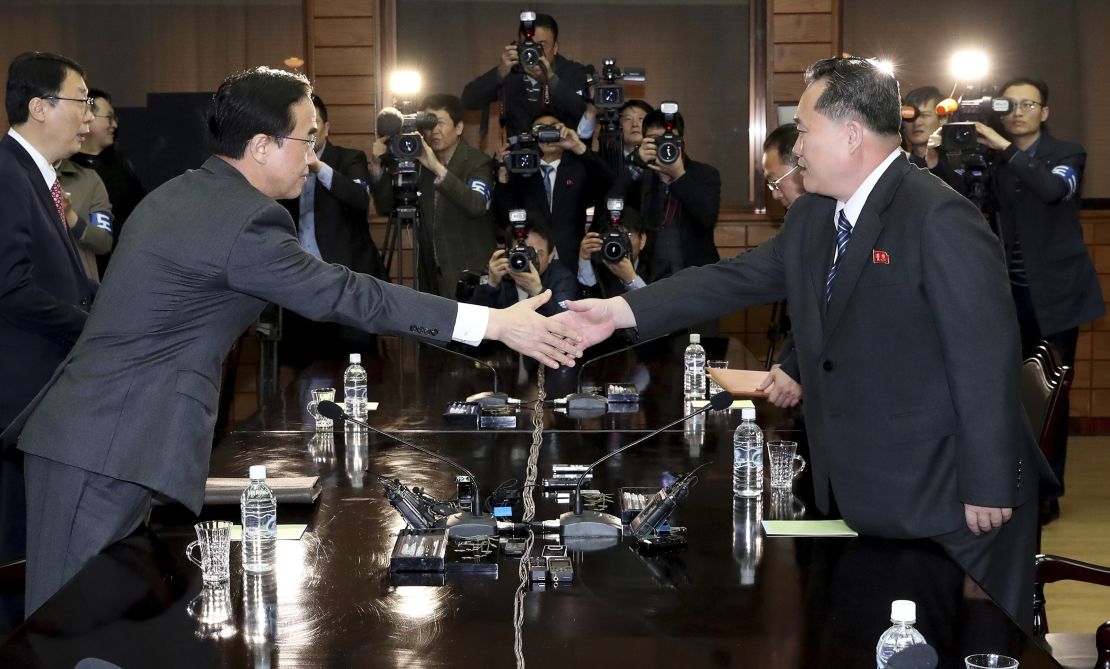 South Korean Unification Minister Cho Myoung-gyon, left, shakes hands with North Korean delegation head Ri Son Gwon at Panmunjom on March 29.
