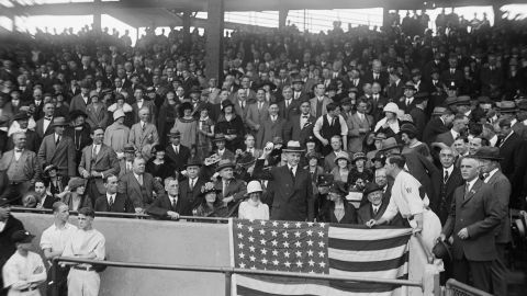 President Calvin Coolidge throws out the first pitch at a World Series game between the Washington Senators and New York Giants, in Washington DC, circa 1924