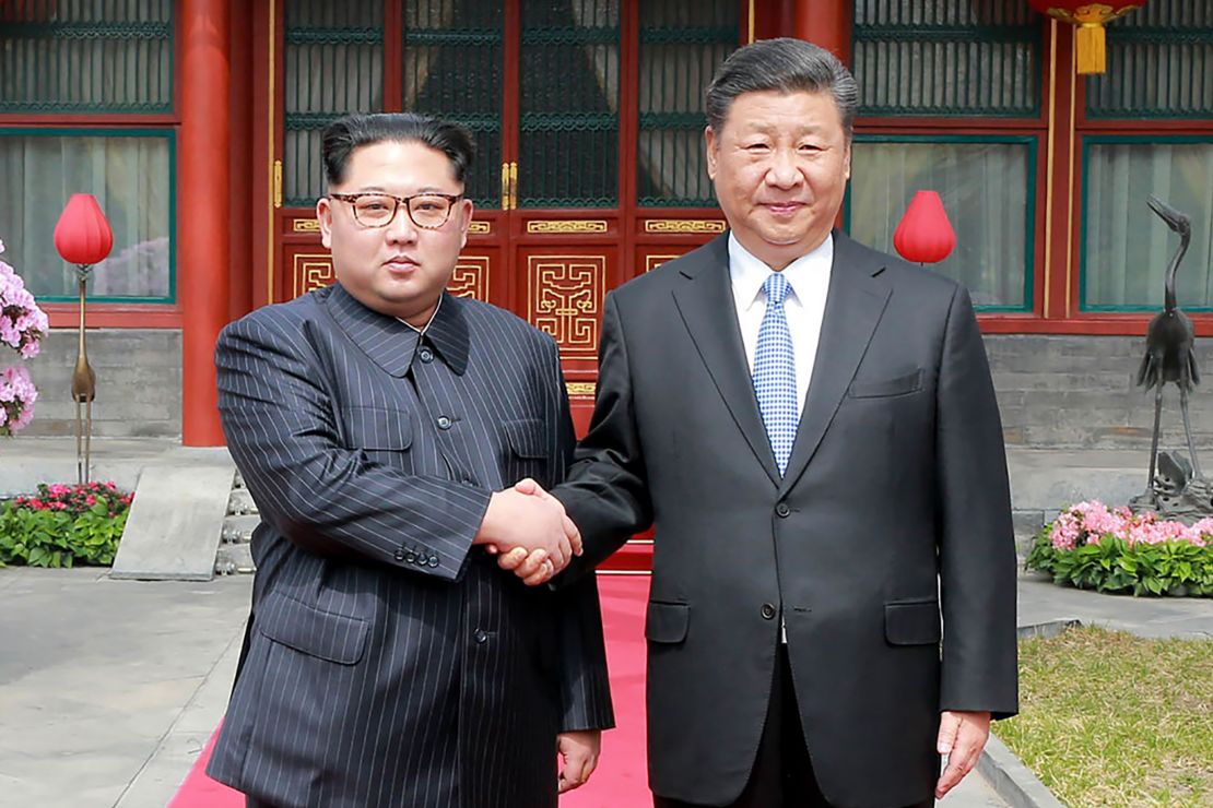 President Xi Jinping shakes hands with North Korean leader Kim Jong Un in Beijing in 2018. (AFP/Getty Images/KCNA VIA KNS)