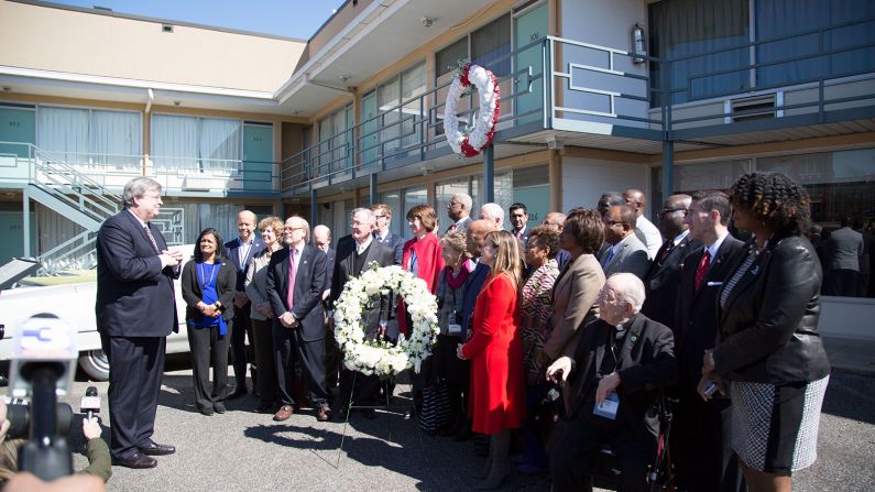Bipartisan members of Congress stand together at the Lorraine Motel to honor King.