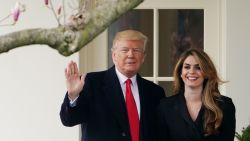 US President Donald Trump poses with former communications director Hope Hicks shortly before making his way to board Marine One on the South Lawn and departing from the White House on March 29, 2018. (MANDEL NGAN/AFP/Getty Images)