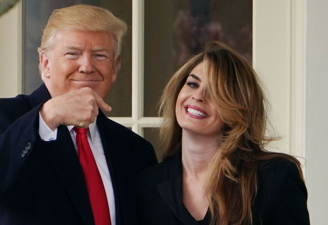 US President Donald Trump points to former communications director Hope Hicks shortly before making his way to board Marine One on the South Lawn and departing from the White House on March 29, 2018. (MANDEL NGAN/AFP/Getty Images)