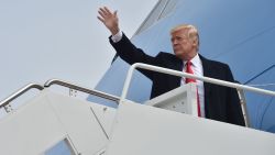 US President Donald Trump waves as boards Air Force One at Andrews Air Force Base in Maryland on March 29, 2018, on his way to Cleveland. (NICHOLAS KAMM/AFP/Getty Images)